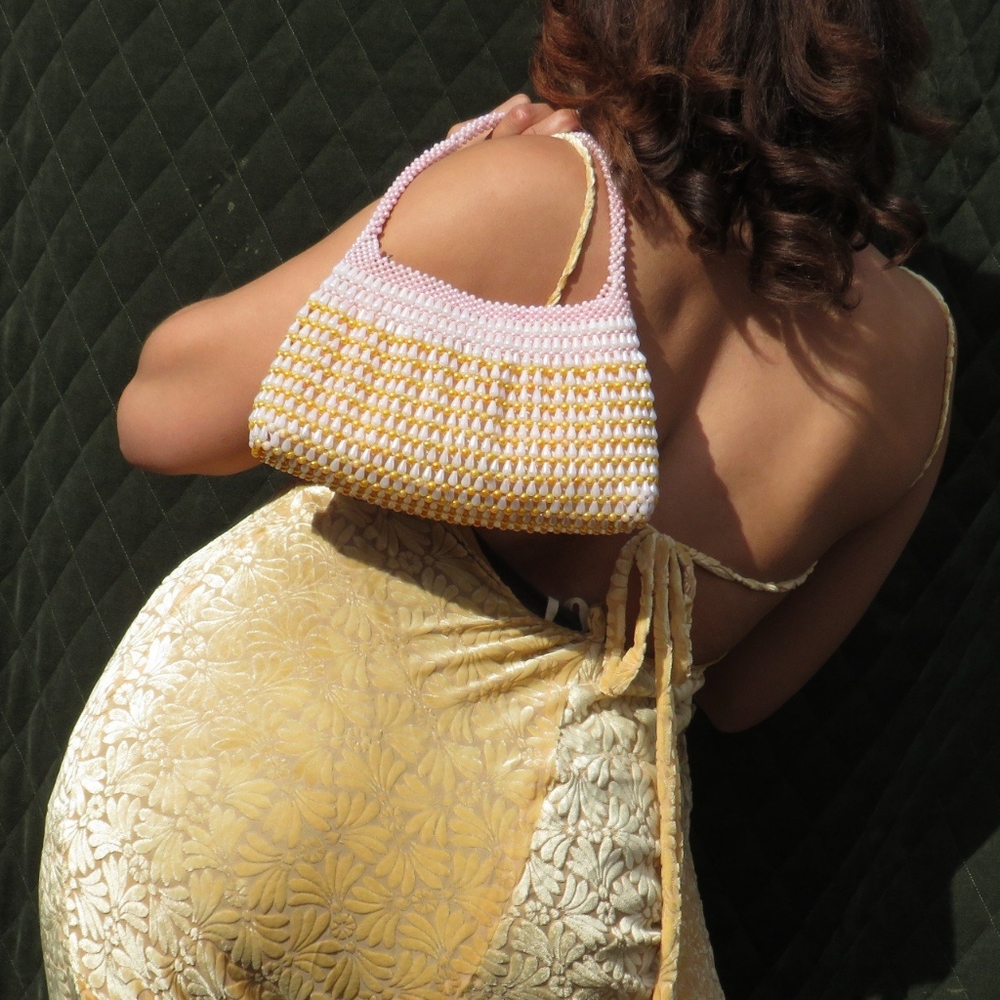 Beaded pearlescent mini hand bag.